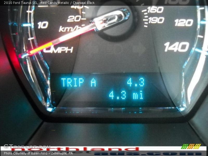 Red Candy Metallic / Charcoal Black 2010 Ford Taurus SEL