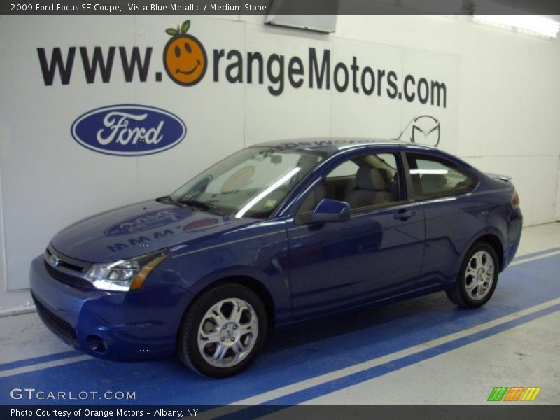 Vista Blue Metallic / Medium Stone 2009 Ford Focus SE Coupe