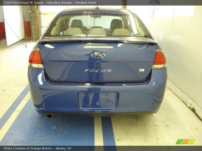 Vista Blue Metallic / Medium Stone 2009 Ford Focus SE Coupe
