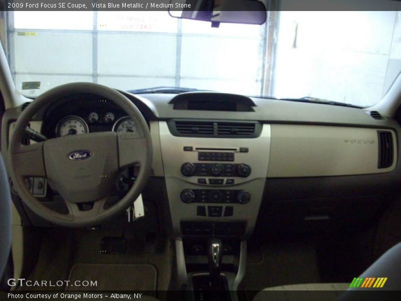 Vista Blue Metallic / Medium Stone 2009 Ford Focus SE Coupe