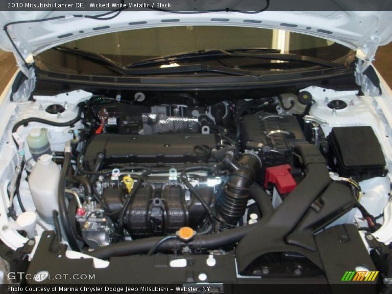 Wicked White Metallic / Black 2010 Mitsubishi Lancer DE