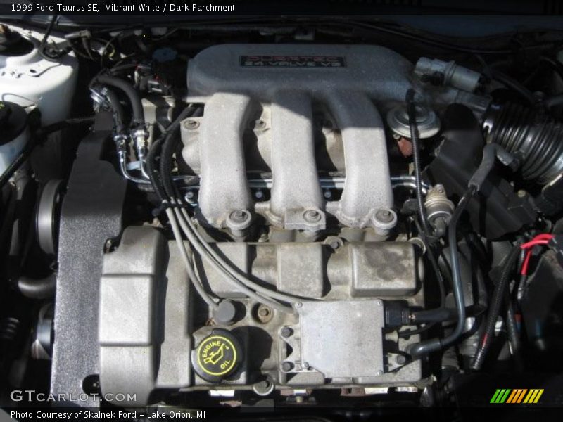 Vibrant White / Dark Parchment 1999 Ford Taurus SE