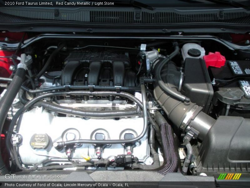 Red Candy Metallic / Light Stone 2010 Ford Taurus Limited