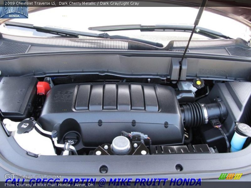 Dark Cherry Metallic / Dark Gray/Light Gray 2009 Chevrolet Traverse LS