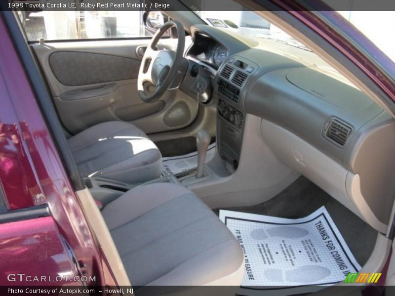 Ruby Red Pearl Metallic / Beige 1998 Toyota Corolla LE