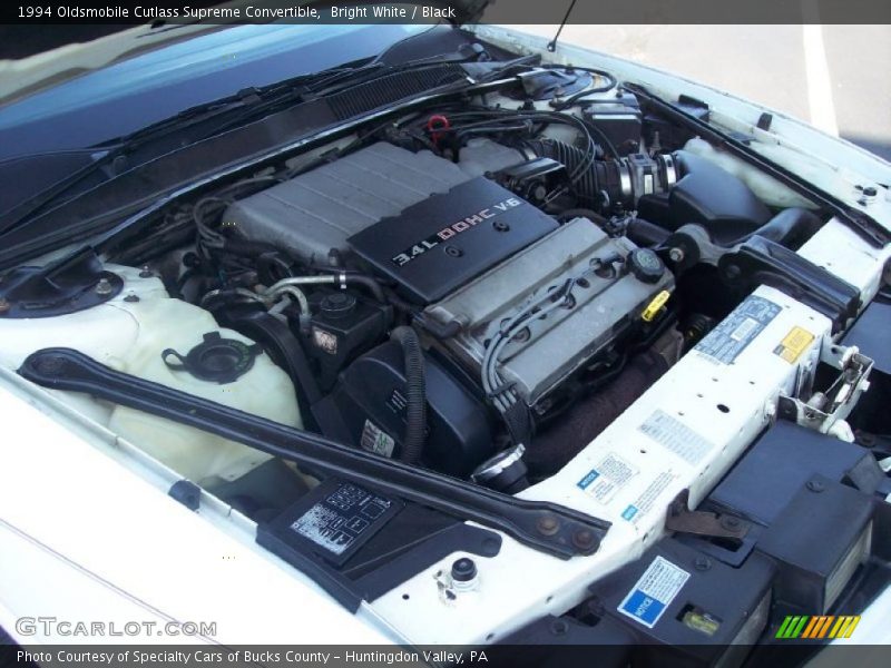 Bright White / Black 1994 Oldsmobile Cutlass Supreme Convertible