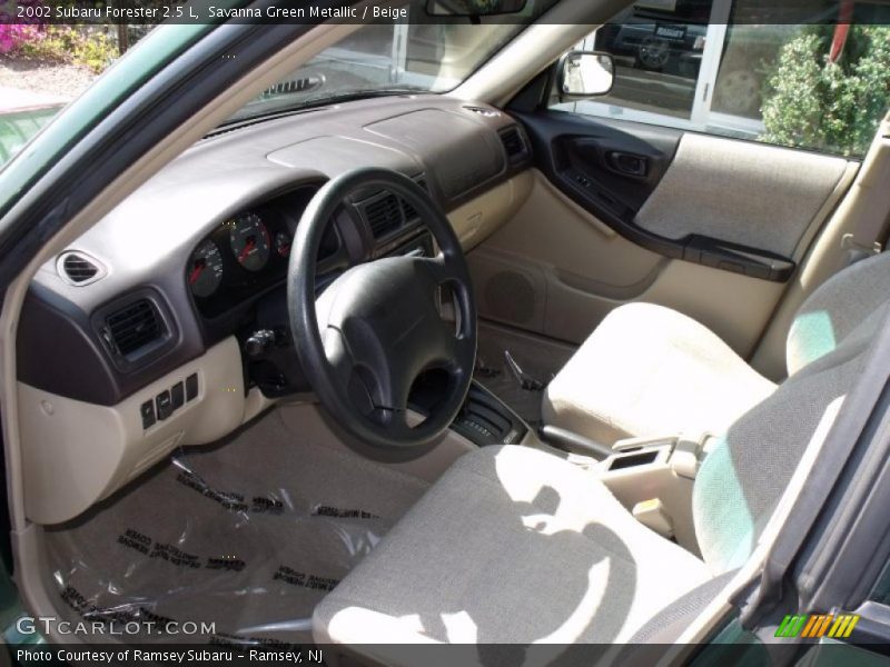 Savanna Green Metallic / Beige 2002 Subaru Forester 2.5 L