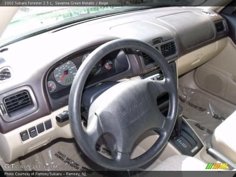 Savanna Green Metallic / Beige 2002 Subaru Forester 2.5 L