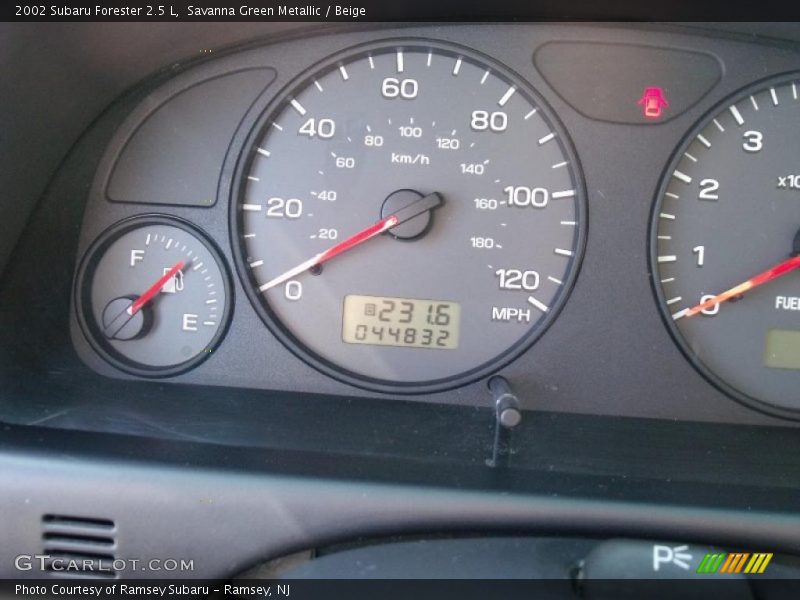 Savanna Green Metallic / Beige 2002 Subaru Forester 2.5 L