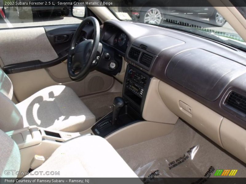 Savanna Green Metallic / Beige 2002 Subaru Forester 2.5 L
