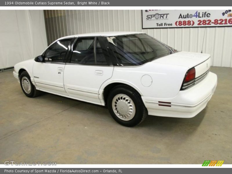 Bright White / Black 1994 Oldsmobile Cutlass Supreme Sedan