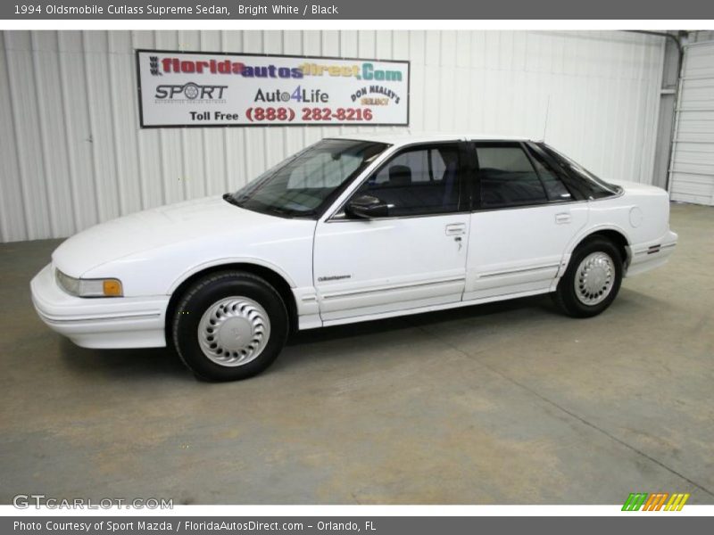 Bright White / Black 1994 Oldsmobile Cutlass Supreme Sedan