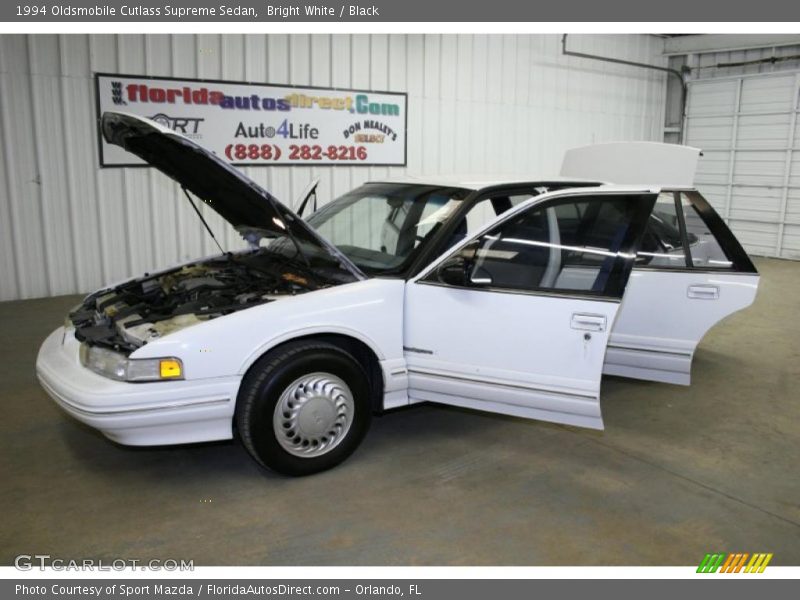 Bright White / Black 1994 Oldsmobile Cutlass Supreme Sedan