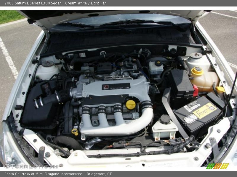Cream White / Light Tan 2003 Saturn L Series L300 Sedan