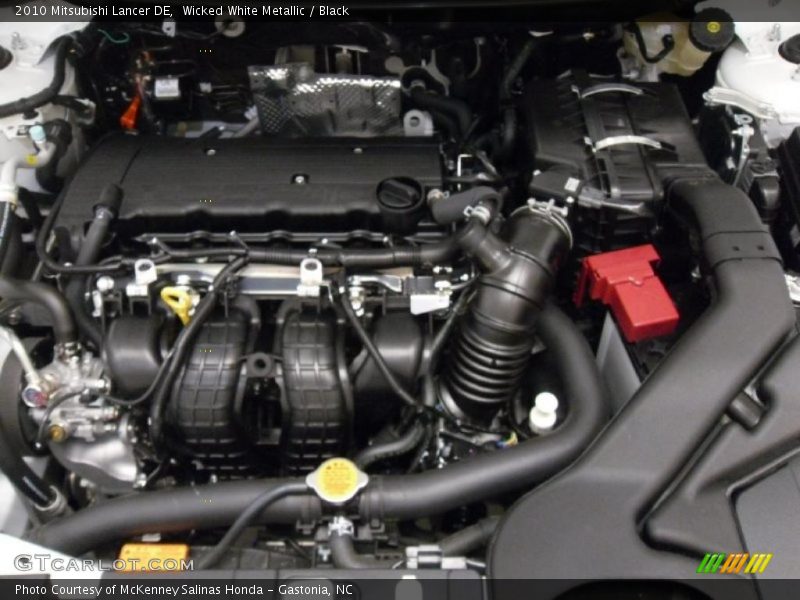 Wicked White Metallic / Black 2010 Mitsubishi Lancer DE
