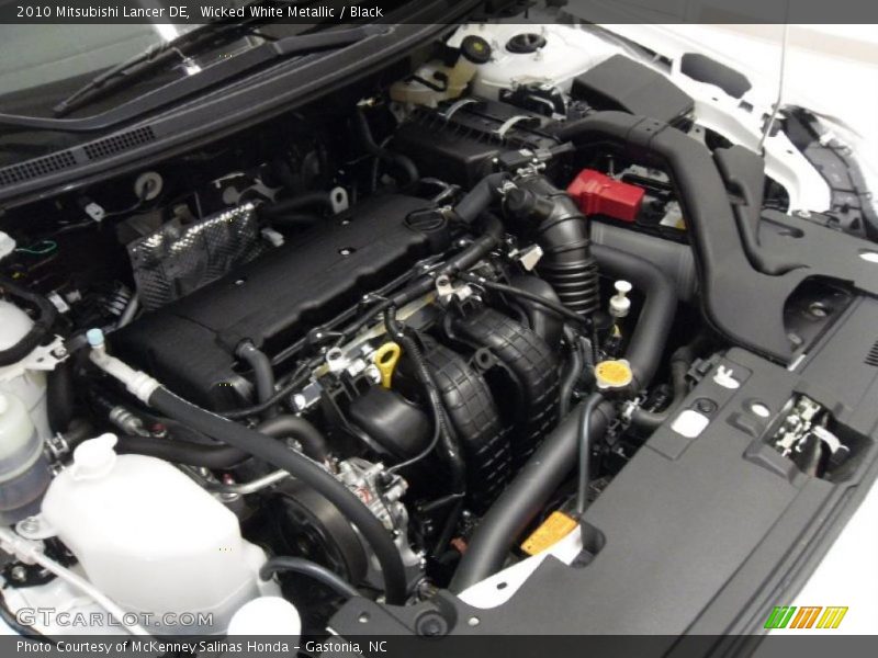 Wicked White Metallic / Black 2010 Mitsubishi Lancer DE