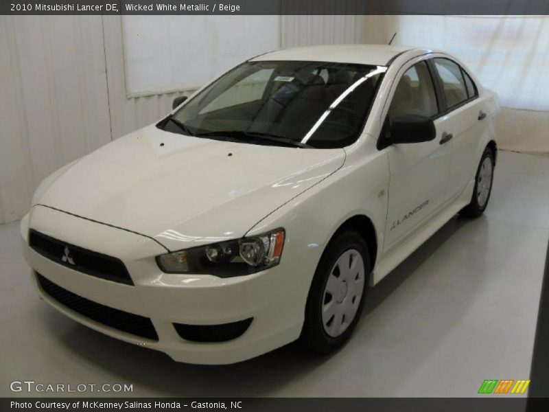Wicked White Metallic / Beige 2010 Mitsubishi Lancer DE