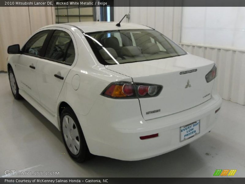 Wicked White Metallic / Beige 2010 Mitsubishi Lancer DE