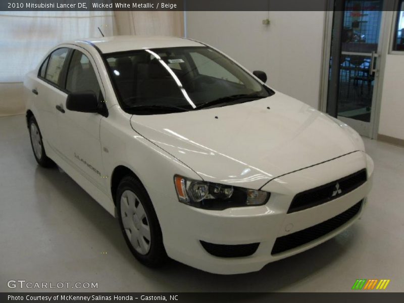 Wicked White Metallic / Beige 2010 Mitsubishi Lancer DE