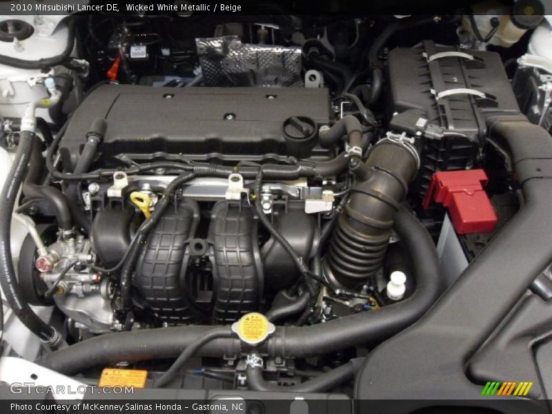 Wicked White Metallic / Beige 2010 Mitsubishi Lancer DE