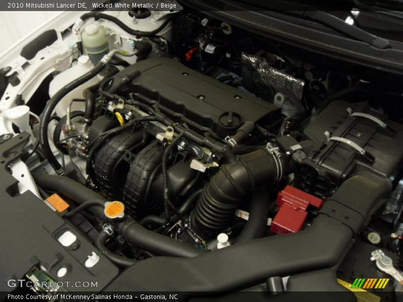 Wicked White Metallic / Beige 2010 Mitsubishi Lancer DE
