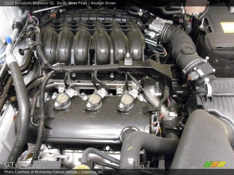 Dover White Pearl / Medium Brown 2010 Mitsubishi Endeavor SE