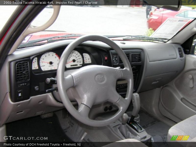 Impulse Red Pearl / Charcoal 2002 Toyota Tacoma Xtracab 4x4