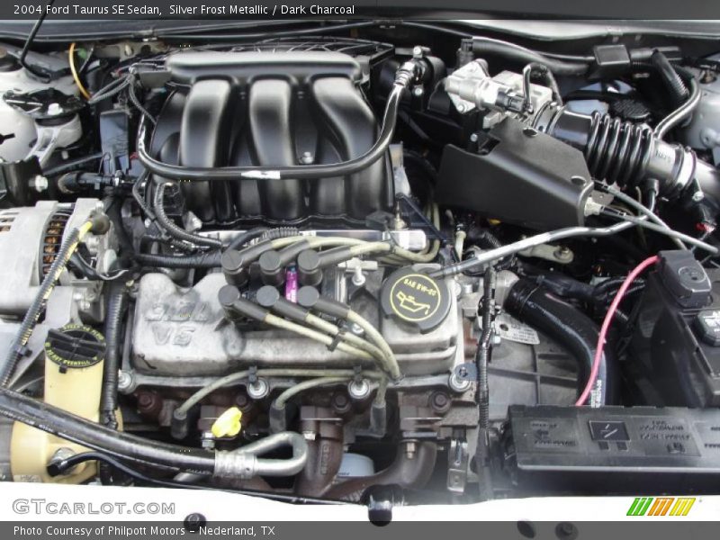 Silver Frost Metallic / Dark Charcoal 2004 Ford Taurus SE Sedan