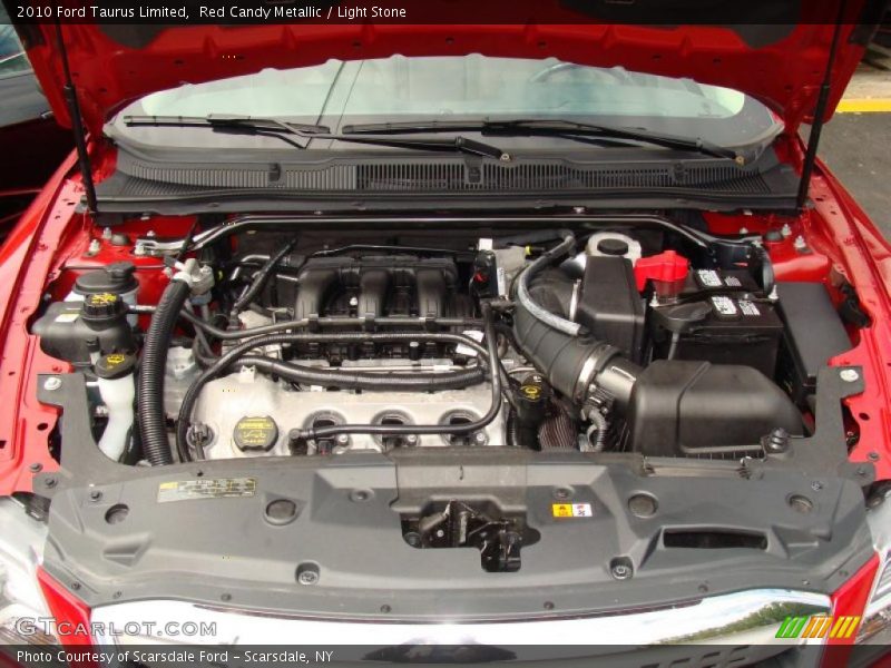 Red Candy Metallic / Light Stone 2010 Ford Taurus Limited
