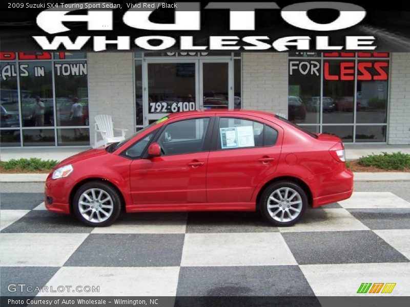 Vivid Red / Black 2009 Suzuki SX4 Touring Sport Sedan
