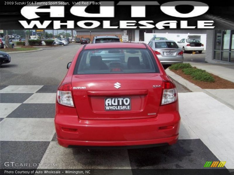Vivid Red / Black 2009 Suzuki SX4 Touring Sport Sedan