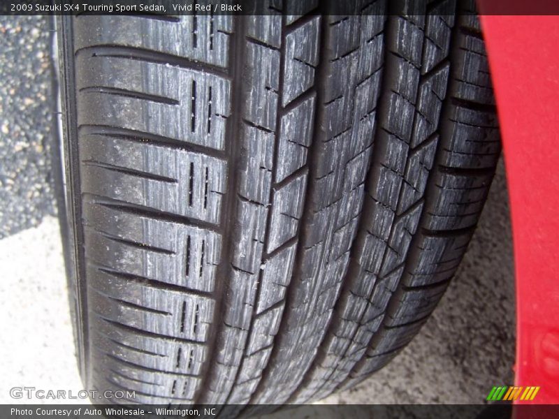 Vivid Red / Black 2009 Suzuki SX4 Touring Sport Sedan