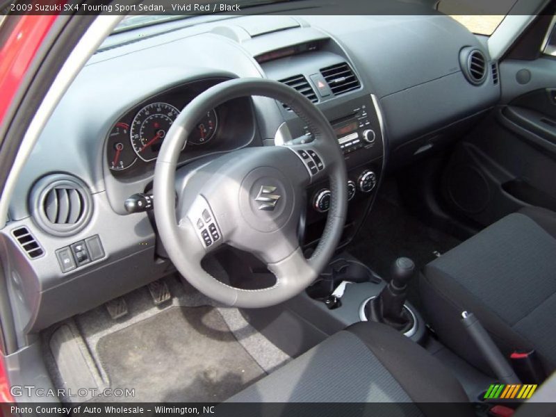 Vivid Red / Black 2009 Suzuki SX4 Touring Sport Sedan