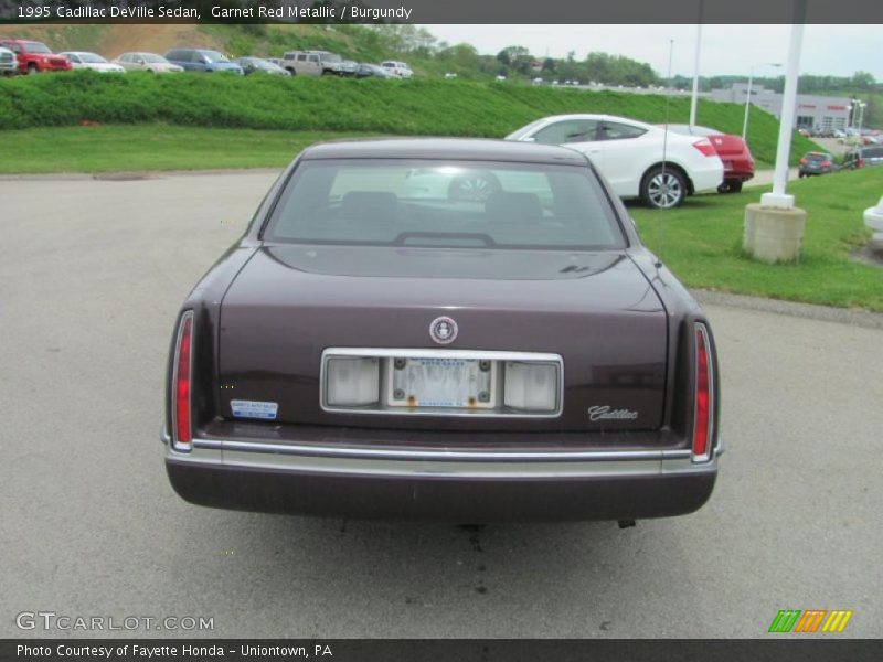 Garnet Red Metallic / Burgundy 1995 Cadillac DeVille Sedan
