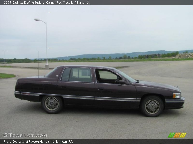 Garnet Red Metallic / Burgundy 1995 Cadillac DeVille Sedan