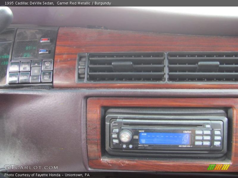 Garnet Red Metallic / Burgundy 1995 Cadillac DeVille Sedan