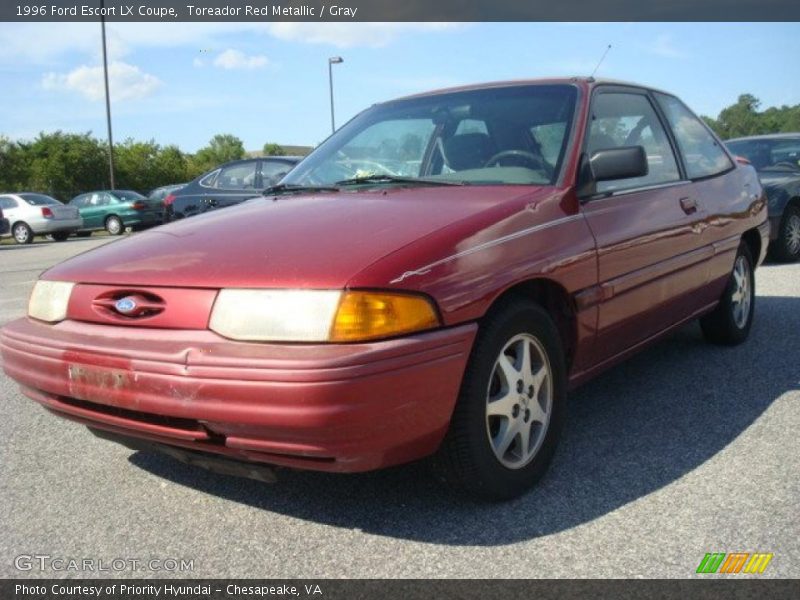 Toreador Red Metallic / Gray 1996 Ford Escort LX Coupe