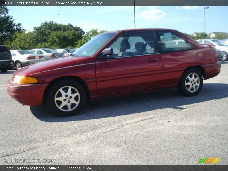 Toreador Red Metallic / Gray 1996 Ford Escort LX Coupe