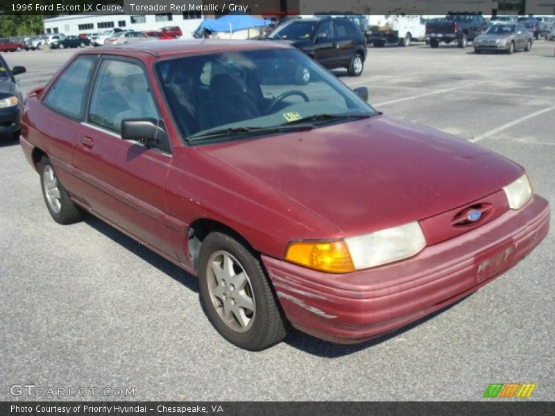 Toreador Red Metallic / Gray 1996 Ford Escort LX Coupe