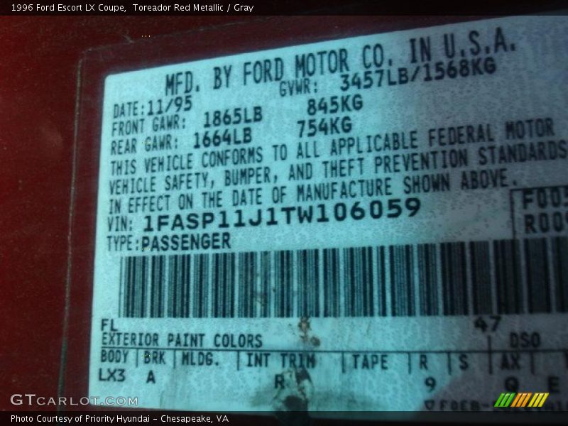 Toreador Red Metallic / Gray 1996 Ford Escort LX Coupe