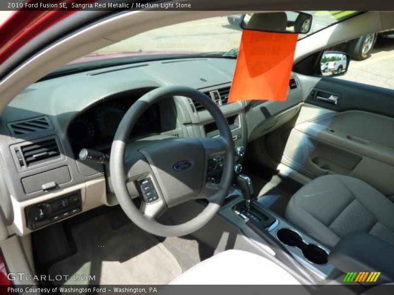 Sangria Red Metallic / Medium Light Stone 2010 Ford Fusion SE