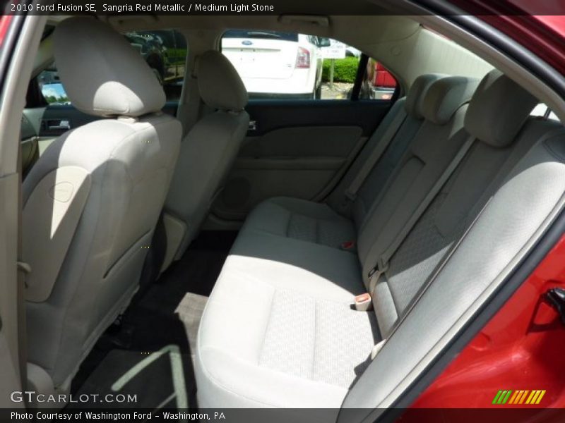 Sangria Red Metallic / Medium Light Stone 2010 Ford Fusion SE