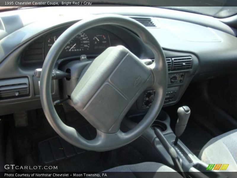 Bright Red / Gray 1995 Chevrolet Cavalier Coupe
