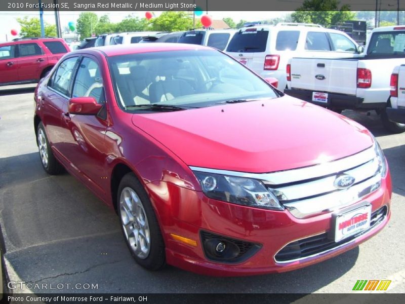 Sangria Red Metallic / Medium Light Stone 2010 Ford Fusion SE