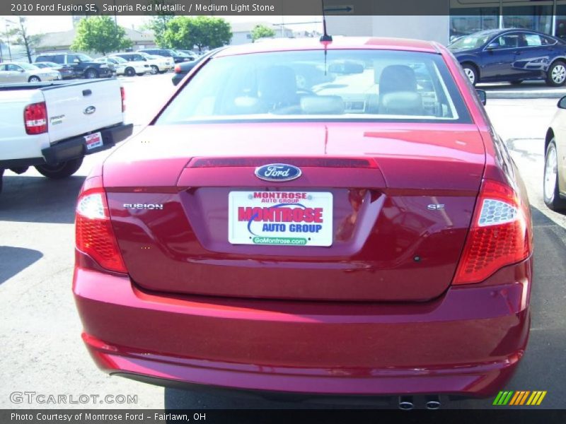 Sangria Red Metallic / Medium Light Stone 2010 Ford Fusion SE