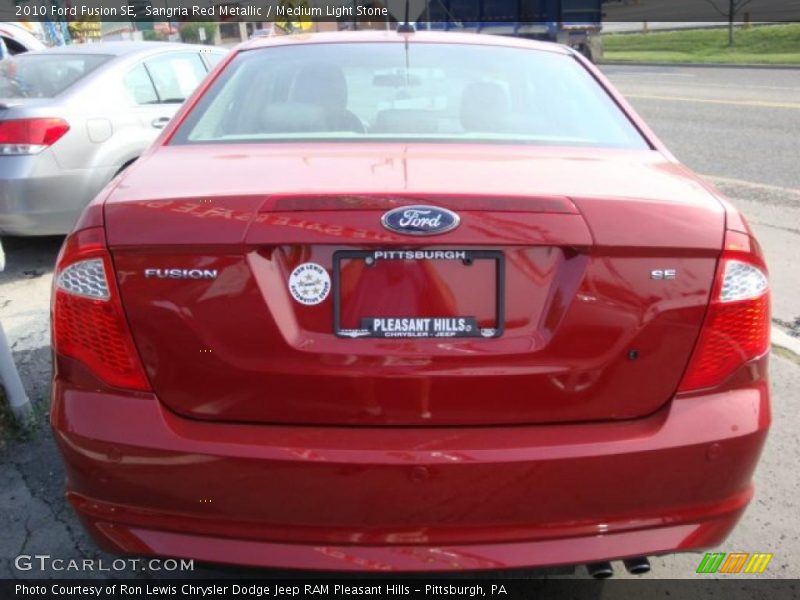 Sangria Red Metallic / Medium Light Stone 2010 Ford Fusion SE