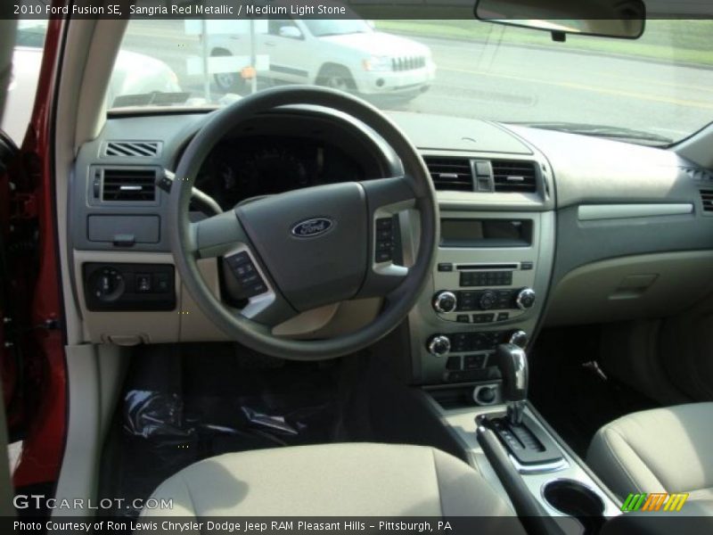 Sangria Red Metallic / Medium Light Stone 2010 Ford Fusion SE