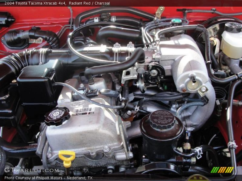 Radiant Red / Charcoal 2004 Toyota Tacoma Xtracab 4x4
