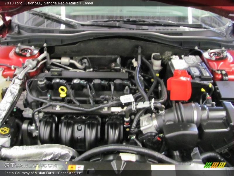 Sangria Red Metallic / Camel 2010 Ford Fusion SEL