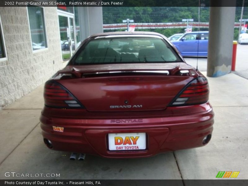 Redfire Metallic / Dark Pewter 2002 Pontiac Grand Am SE Sedan
